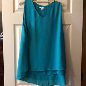 Teal green sleeveless blouse